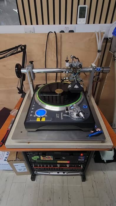 Back on the tools cutting records in the workshop.