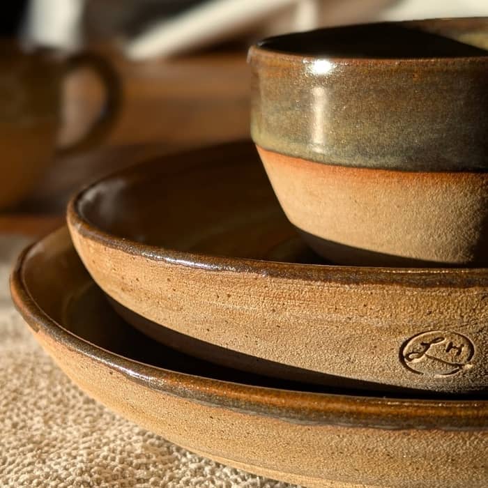 New plates, jugs and mugs in cosy browns and blues.