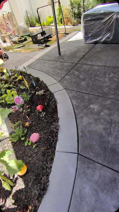 The wet-look finish on stamped concrete never gets old 😍 Walked this path, opened the sealant, and sprayed it to perfec
