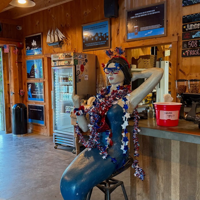 Bad Martha Farmer’s Brewery in Edgartown. Barn setup, mermaid at the bar, mug club racks lined up, a...