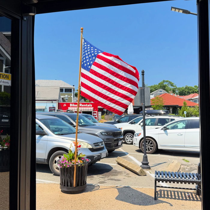 View out the bus door in Vineyard Haven. Flag out, Friday before the 4th.Visit: https://mvvacation....