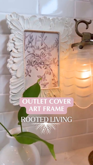 Wall Outlet Cover DIY — I turned an ugly wall plate into a piece of art with a picture frame.

Budget-friendly home decor hack is perfect for hiding wall outlets in your kitchen, bathroom, or any room where you don’t want to see plugs on the wall. I used a small frame and then my mod podge trick to a picture, removed the back hardware to make sure I had a flat surface to hot glue on child safety plastic outlet covers. When I need to use the outlet, I will just take the frame off, plug in my appliance, and pop it back in place when I’m done.

This simple DIY project is a great way to upgrade any space with creative wall decor while covering unsightly or unneeded wall outlets.

Follow @rootedliving_ga for more thrift flips, budget-friendly DIY home decor, creative home decorating ideas, vintage-inspired decor, textured wall art, gallery wall inspiration, air dry clay DIYs, Rub ’n Buff projects, mod podge, frame makeovers, and step-by-step craft tutorials.