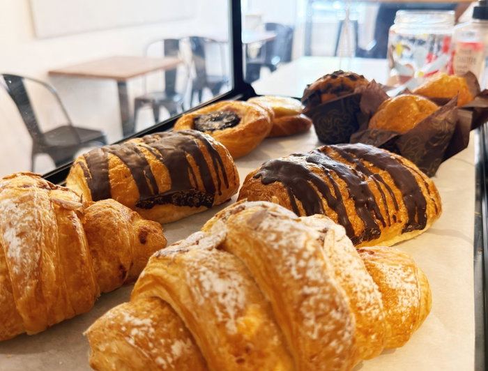 Blue House Cafe on Instagram: In the case this morning: buttery croissants and chocolate-drizzled pastries, catching the morning light by the window. 