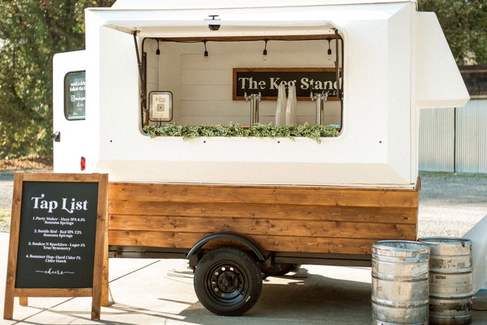 How The Keg Stand Got Its Name 🍻
People ask all the time… “Where did The Keg Stand come from?”
It actually started with an old hot dog stand.
The idea was simple — take that old-school stand concept and turn it into a beer stand that could show up anywhere, serve local craft beer fresh from kegs, and bring people together.
The name came from a play on words. A little twist on the classic hot dog stand mixed with something everyone knew… the keg stand.
It was all about the feeling.
Back when things were simpler, you didn’t need much to have a great time. Someone brought a keg, friends showed up, music was playing, and everyone just enjoyed the night.
No fancy setups. No trying to impress anyone.
Just cold beer, good conversations, and memories with good people.
That’s the feeling we wanted to bring back.
What started as an idea for a little beer trailer turned into far more… and eventually our brewery.
The name stayed the same because the reason behind it never changed.
Bring people together. Enjoy life. Make memories. Keep it simple!
And that’s exactly how we want to keep it!
Cheers 🍻