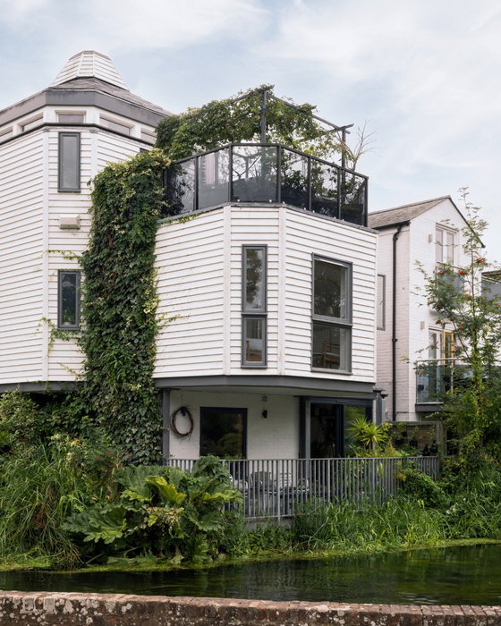Water Works: a riverside home in Canterbury, Kent, with staggered living spaces, private balconies a