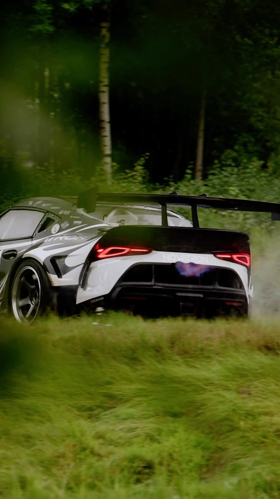 Kalle Rovanperä behind the wheel of a 2JZ-powered Toyota GR Supra during a sponsor PR shoot on a clo