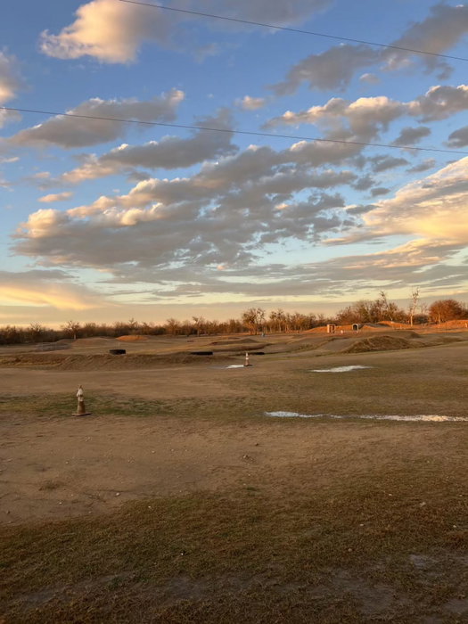 Evening clouds and golden light over the Creekside motocross track