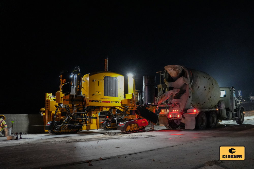 Big machines, tight tolerances, and miles of progress. A GOMACO GT-3600 slips barrier wall on a major Central Texas highway.