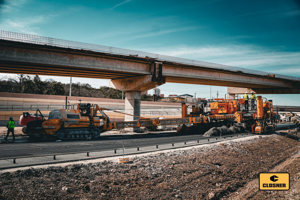 GOMACO iron on the move.

The RTP-500 is spreading concrete while the GP3 keeps the paving operation moving. Another step toward a long-lasting roadway in Austin, Texas.