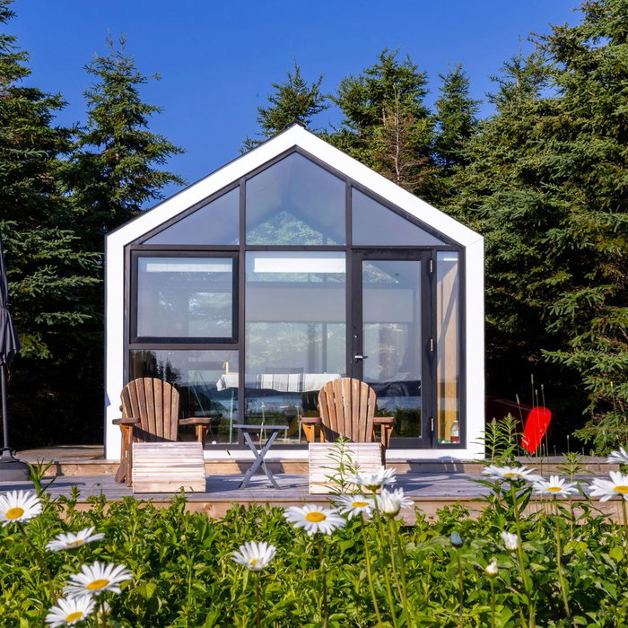 Bunkie by the sea. A place for you and me.

This beautiful #Monarch175bunkie was built back in 2021. It was a time when some folks took the opportunity to create a refuge from the world that was quickly changing around them.

Designed to be a sanctuary in every sense of the word, each piece was transported by ATV on a small trailer to the site, a small outlet near the seashore. Visions realized, backs strained and memories made.

This is a very special place. If you've been following us for some time, this is the bunkie that survived Hurricane Fiona a few years ago without a scratch. Being thoroughly anchored to the ground with no overhangs makes this build quite resilient to extreme weather.

It's amazing to see these projects years later, doing their thing in the wild. We're so grateful to those who embrace the process and are left with a modern, cozy retreat, and a bucket full of memories.

#BunkieLife #CoastalRetreat #NatureEscape #ResilientDesign #BuildingMemories #OutdoorSanctuary #SeasideLiving #ModernCottage