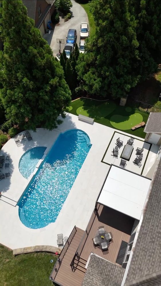 Porcelain patio. Stacked stone veneer. Custom fire pit. Pool renovation. Putting