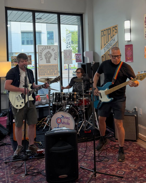Catch Outside the Lines at the Squirrel Hill Night Market tomorrow at 6:30pm! ⚡️❤️‍🔥

OTL is a local rock trio, whose band members met at Sunburst School of Music’s adult band program in the Squirrel Hill neighborhood of Pittsburgh. Musical influences include Radiohead, Beck, Sleater Kinney, the Strokes, and Raconteurs.

With the addition of Stewart Spencer in 2023, OTL was able to transform their gritty energy from a cover band, into their own authentic sound, commanding your attention every time they play. Their lyrics playfully observe everyday life, while also taking serious note of the concerning changes in the world. OTL is beat obsessed, and melody driven. You won’t want to miss hearing their vocal harmonies at Sept 26th SQNM!!

OTL Band members include:
Stewart Spencer: lead guitar and vocals
David Whitney : bass and vocalist
Judy Douglas: drums
