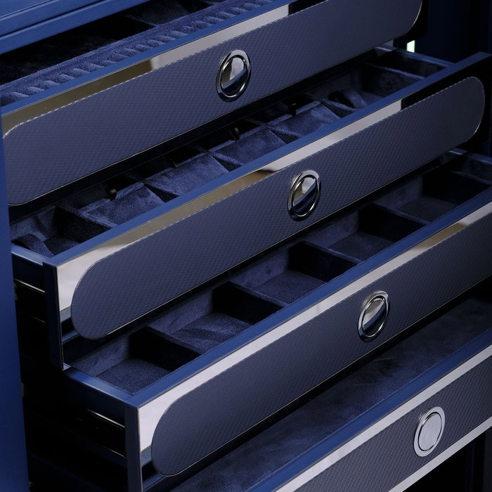 Suede-soft Alcantara, cut into compartments for every piece you've chased. Carbon fronts. Chrome tha