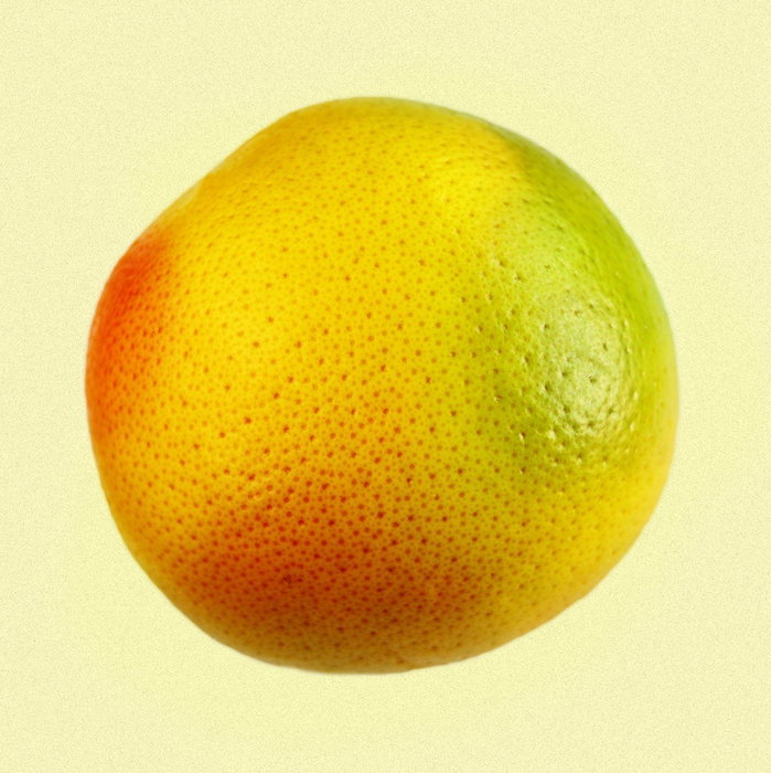 Photograph of an orange, Red and green citrus fruit.