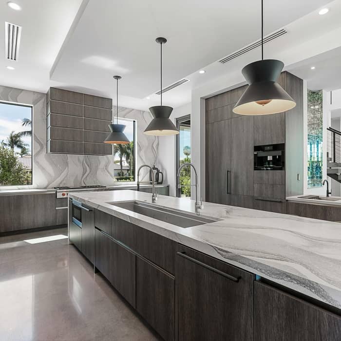 “Contemporary with an industrial edge, this space features polished concrete floors that flow seamlessly throughout, setting the tone for a sleek, modern aesthetic. Clean-lined finishes and thoughtfully selected hardware highlight our client’s sophisticated style, while the raw texture of concrete adds depth and character to the contemporary design.”